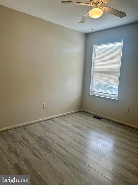 72 Bentwood Drive Westampton, NJ 08060 - Photo 26 of 48 an empty room with wooden floor and windows