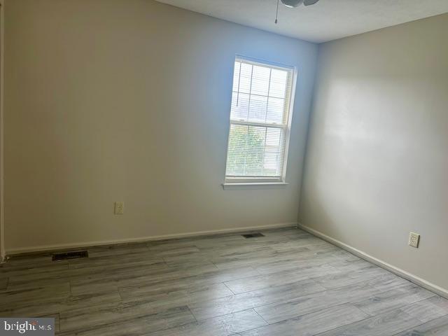 72 Bentwood Drive Westampton, NJ 08060 - Photo 27 of 48 an empty room with wooden floor and windows