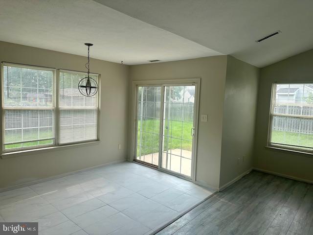 72 Bentwood Drive Westampton, NJ 08060 - Photo 9 of 48 a view of an empty room with a window and wooden floor