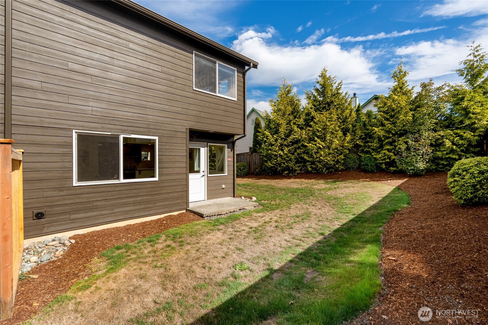 3910 132nd Street Southwest, Unit B Lynnwood, WA 98087 - Photo 29 of 30 a front view of a house with garden