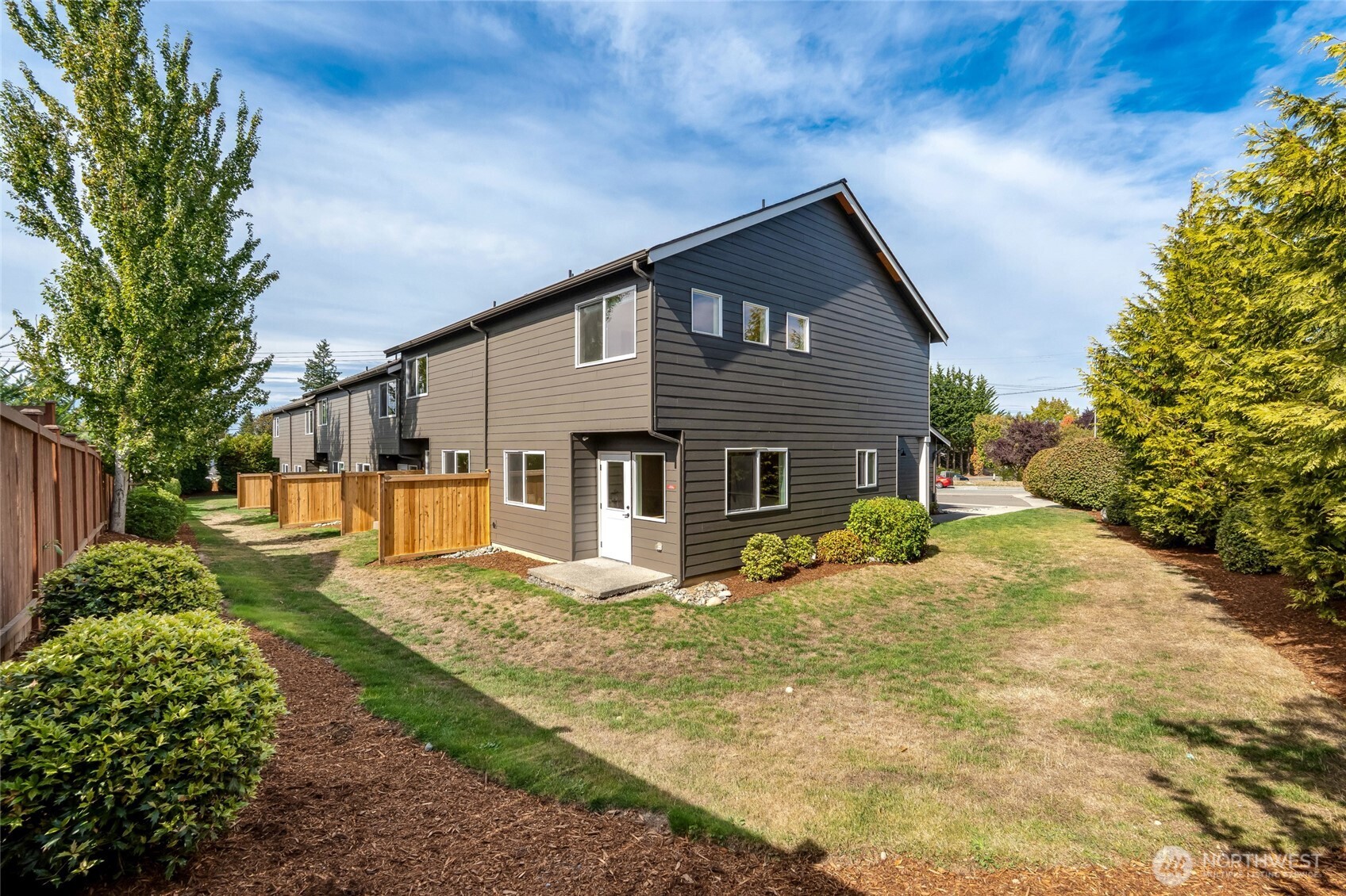 3910 132nd Street Southwest, Unit B Lynnwood, WA 98087 - Photo 30 of 30 a front view of a house with a yard