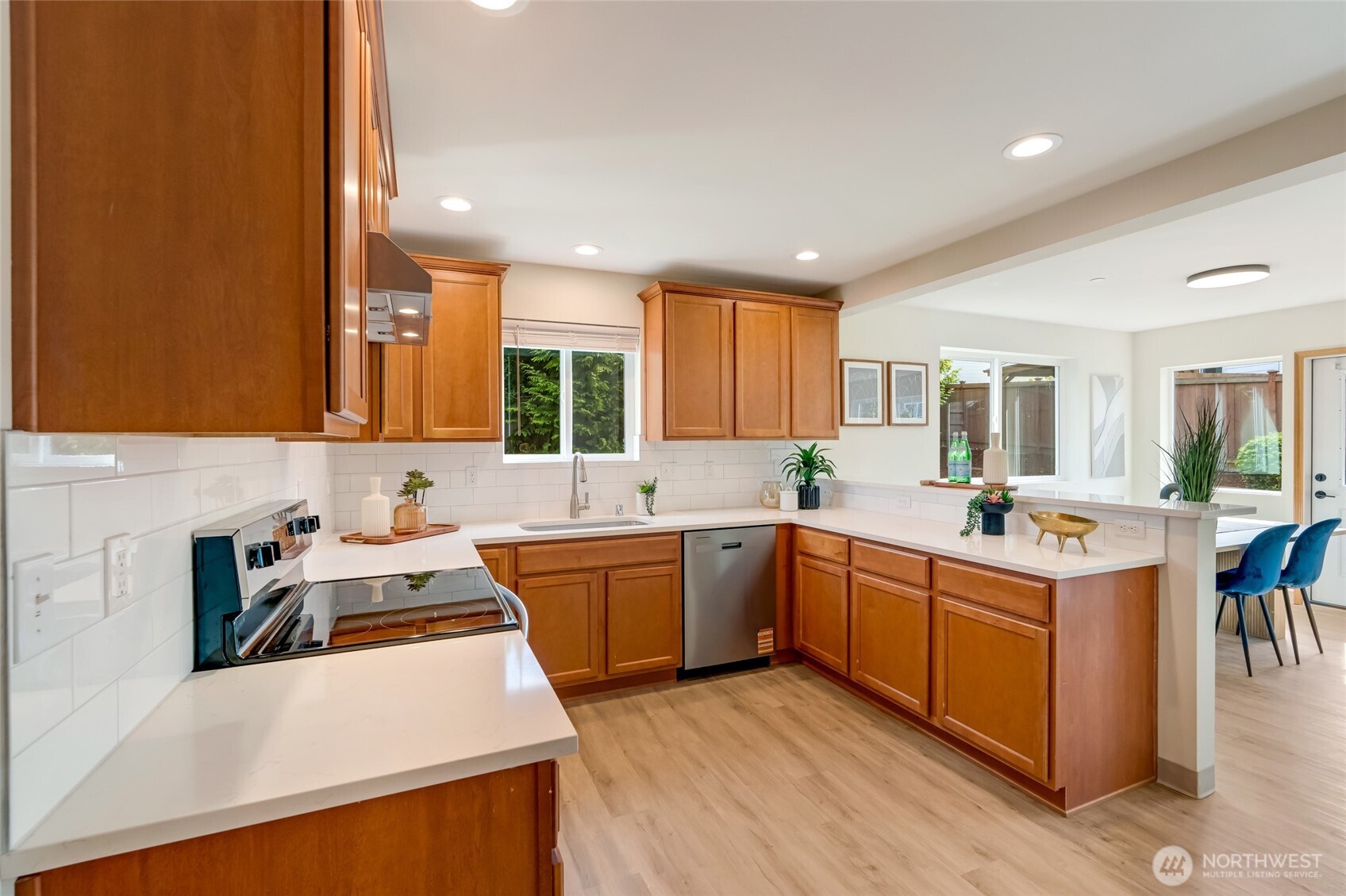 3910 132nd Street Southwest, Unit B Lynnwood, WA 98087 - Photo 8 of 30 a kitchen with stainless steel appliances granite countertop a sink stove and refrigerator