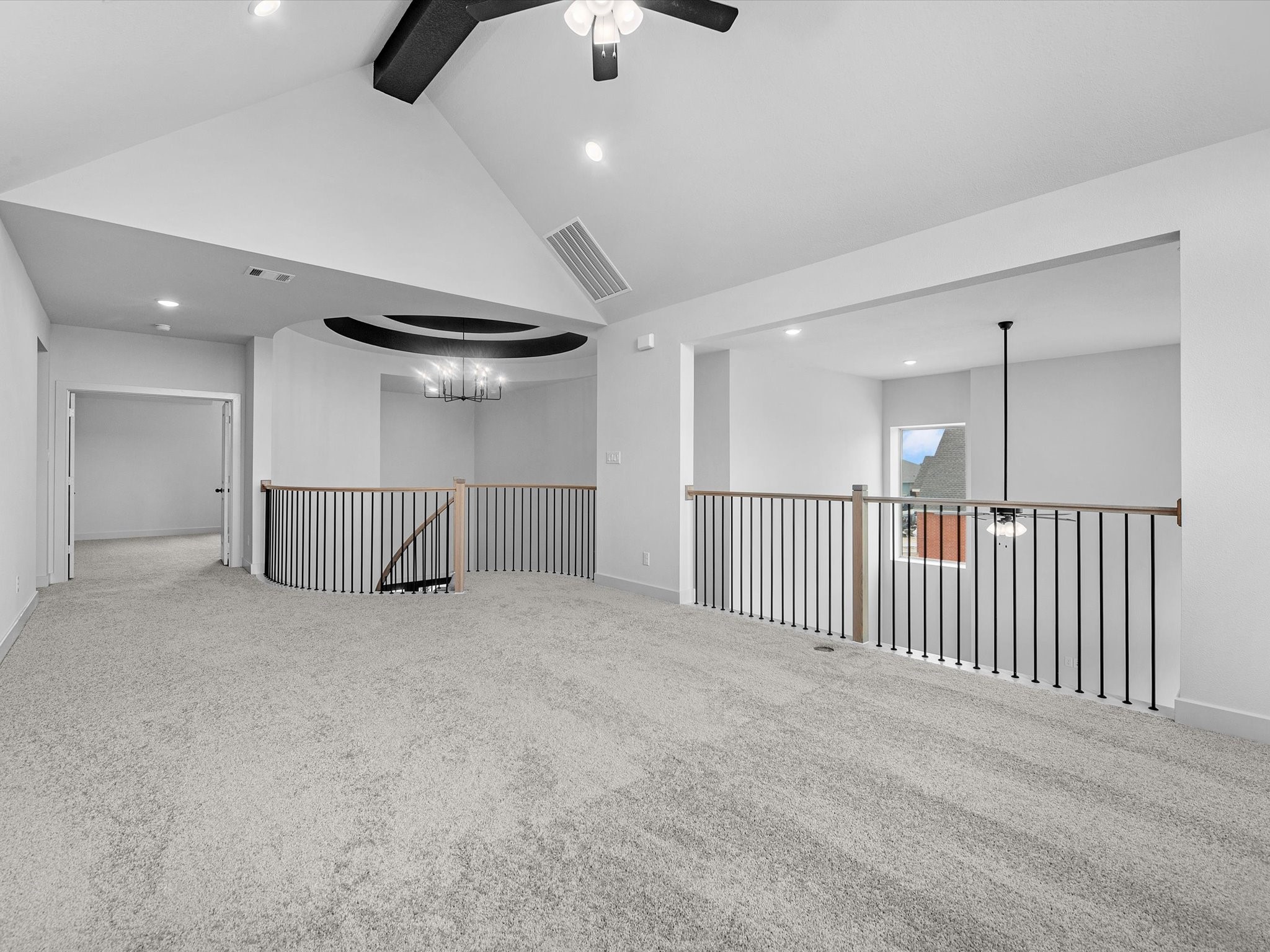 8915 Acropolis Lane Manvel, TX 77578 - Photo 20 of 32 an empty room with a ceiling fan and windows