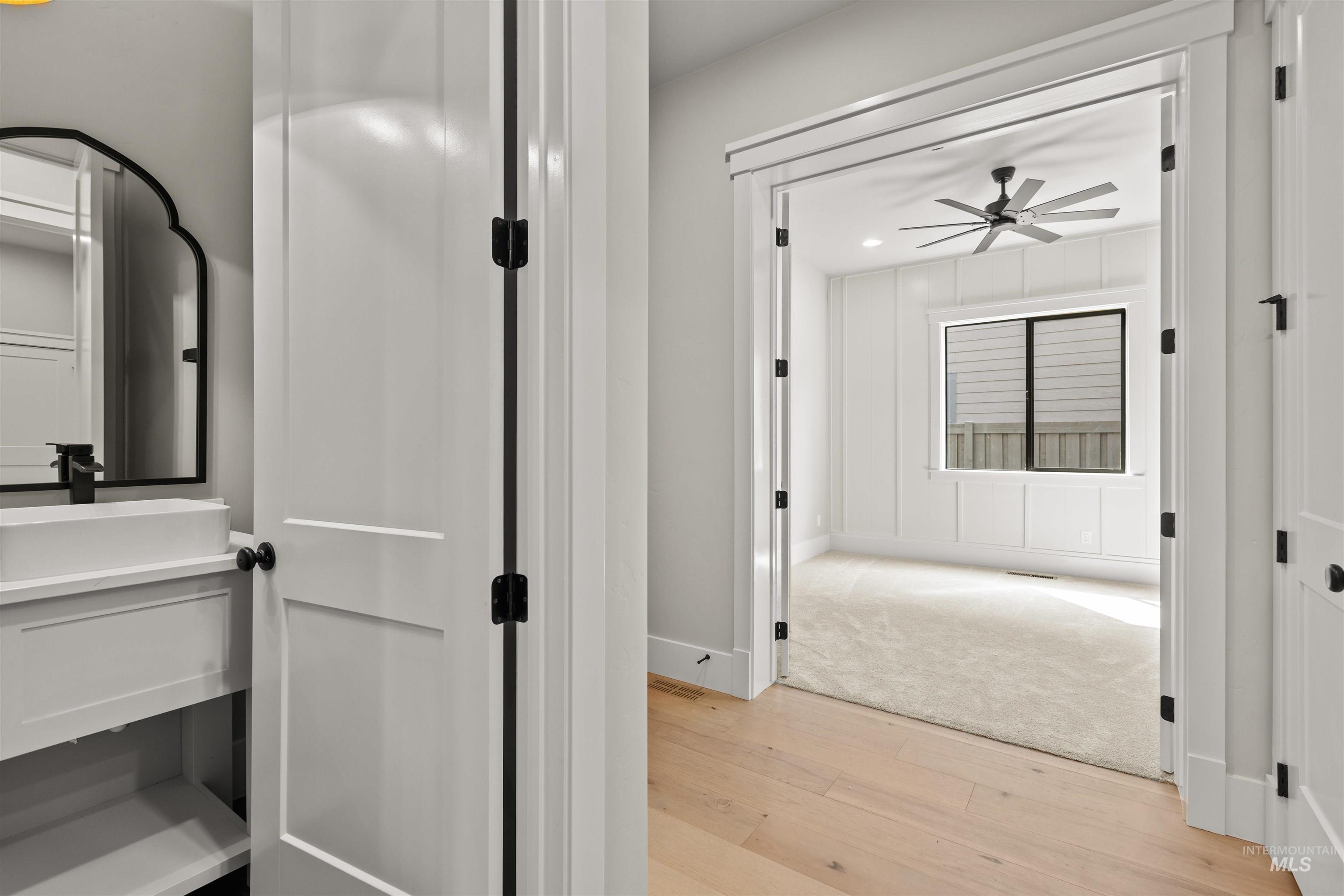 6891 South Utmost Way Meridian, ID 83642 - Photo 34 of 46 Corridor with light wood-type flooring and a sink