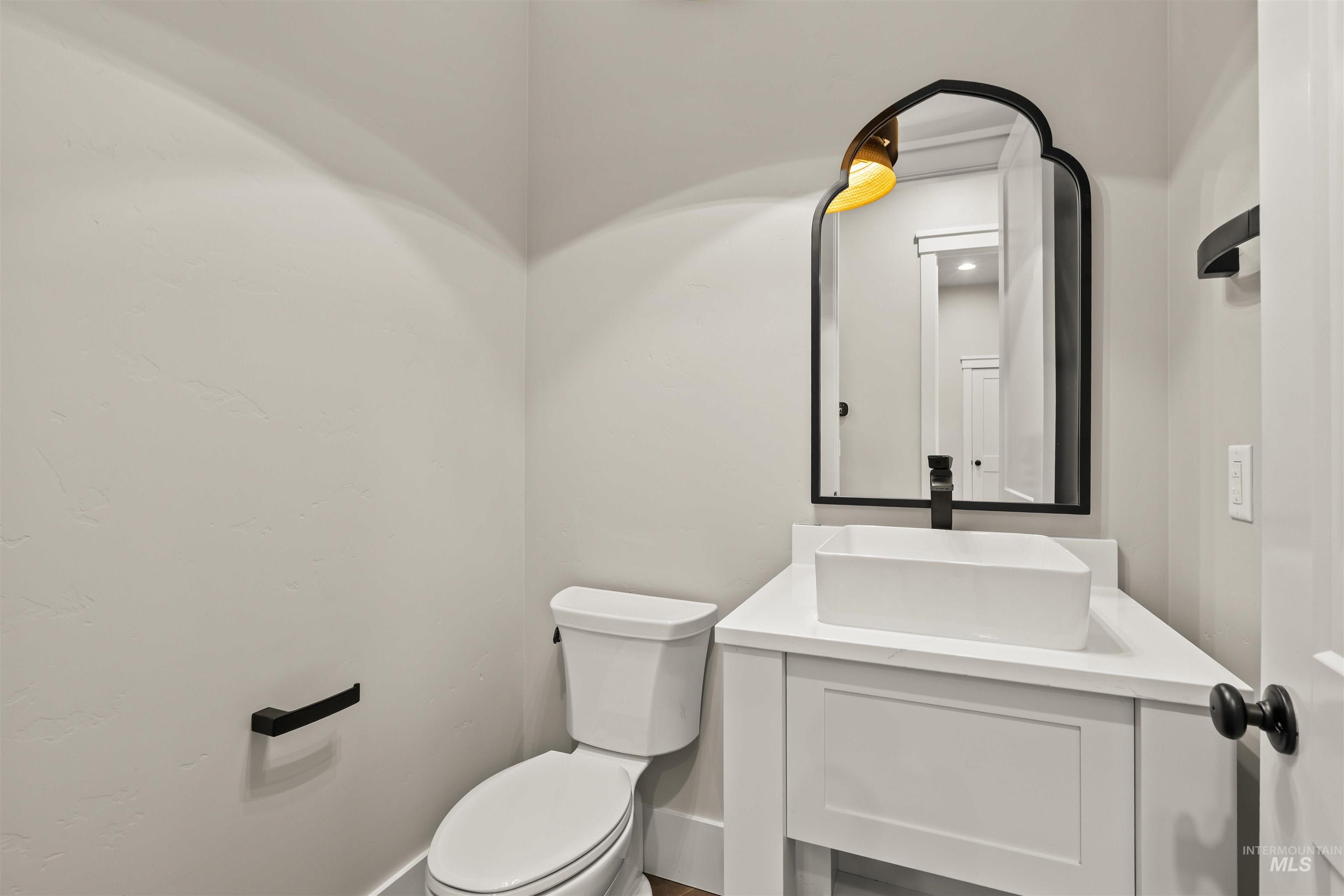 6891 South Utmost Way Meridian, ID 83642 - Photo 35 of 46 Half bath with vanity and toilet