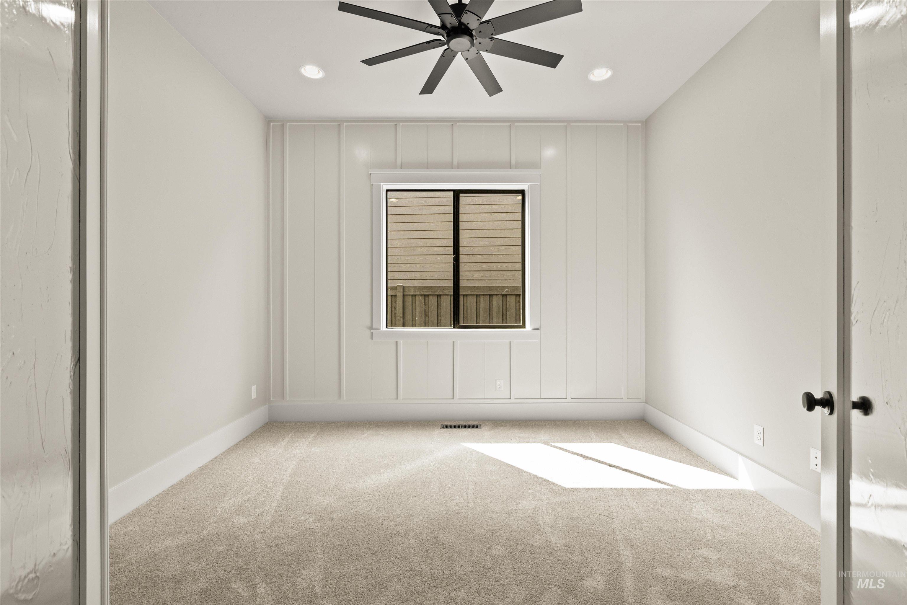 6891 South Utmost Way Meridian, ID 83642 - Photo 36 of 46 Spare room with carpet flooring, recessed lighting, and a ceiling fan