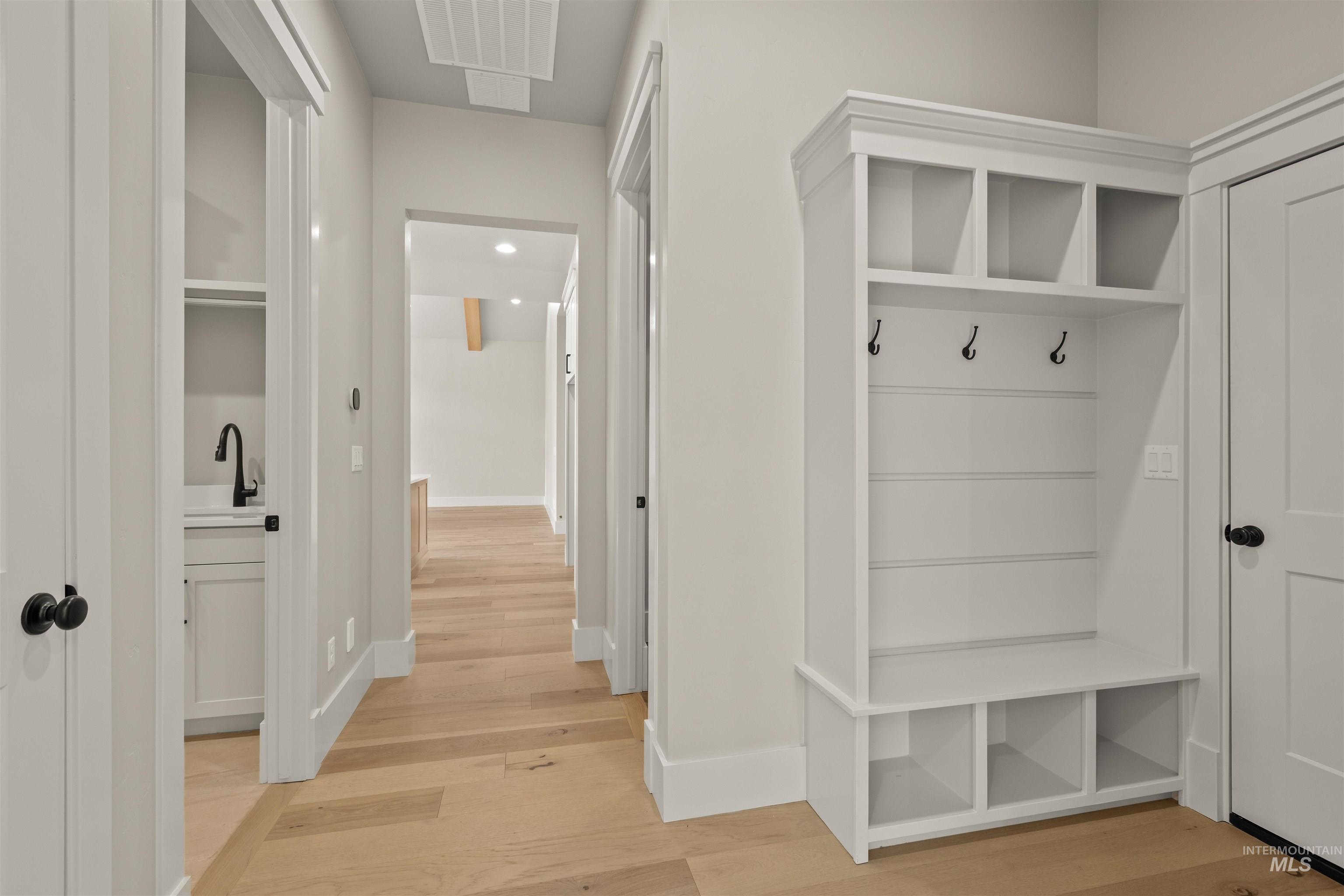 6891 South Utmost Way Meridian, ID 83642 - Photo 37 of 46 Mudroom featuring light wood-style flooring and baseboards