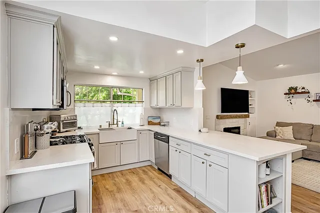 a kitchen with a sink stove and cabinets