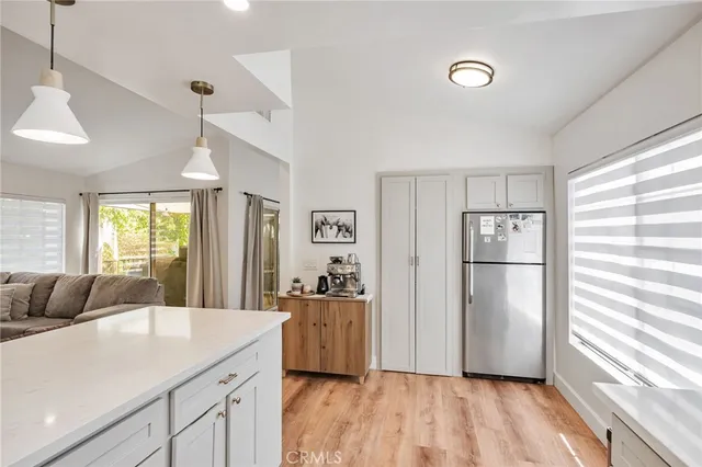a view of a storage and utility room with washer and dryer