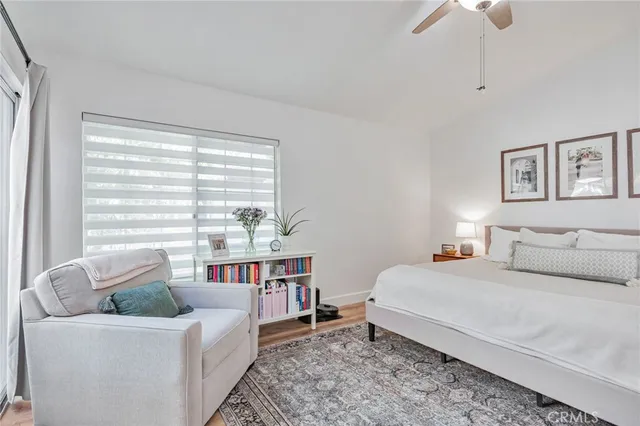 a bedroom with furniture and a chandelier