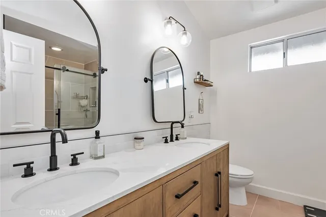 a view of walk in closet with wooden floor
