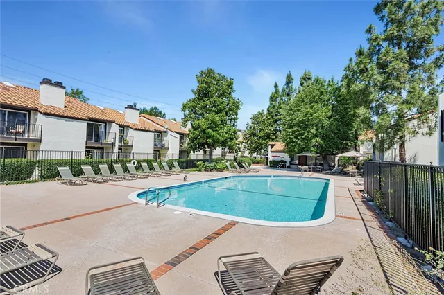 a view of a swimming pool with a yard