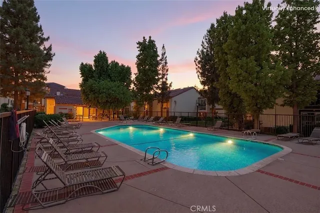 a view of a chair and table on the garden