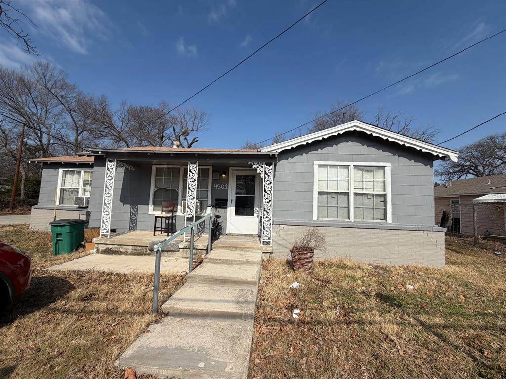 a front view of a house with a yard outdoor seating and garage