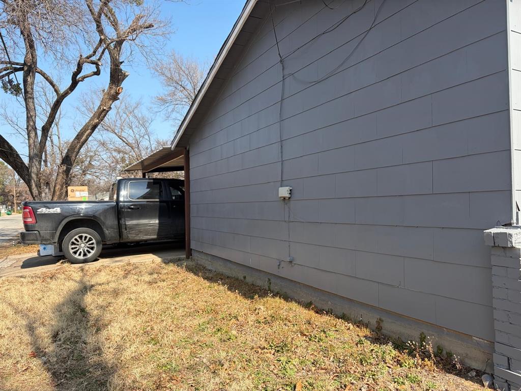 4501 Parrish Road Haltom City, TX 76117 - Photo 14 of 27 a view of a car garage door
