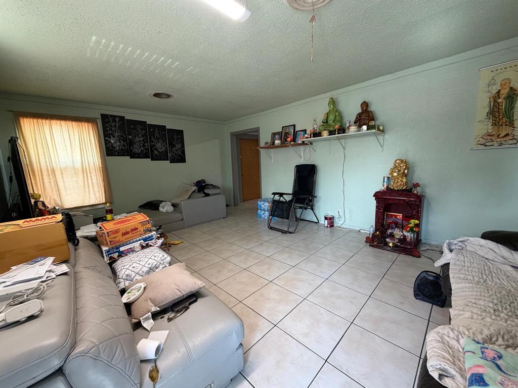 4501 Parrish Road Haltom City, TX 76117 - Photo 26 of 27 a living room with furniture and a wooden floor