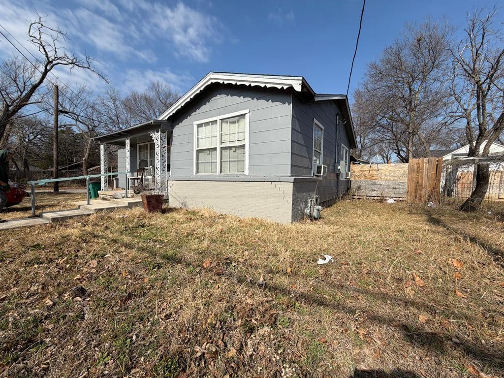 4501 Parrish Road Haltom City, TX 76117 - Photo 3 of 27 a view of a house with a yard