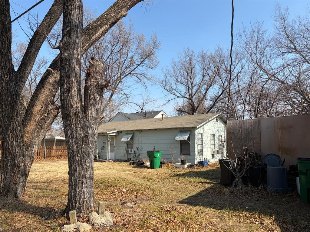 4501 Parrish Road Haltom City, TX 76117 - Photo 8 of 27 a view of a house with a tree in front of it