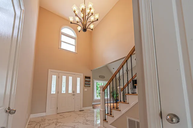a bedroom with a bed lamps and window