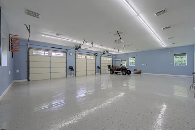 a kitchen with stainless steel appliances granite countertop a sink a stove and cabinets