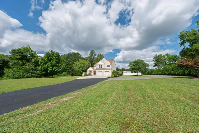 a front view of house with outdoor space and swimming pool