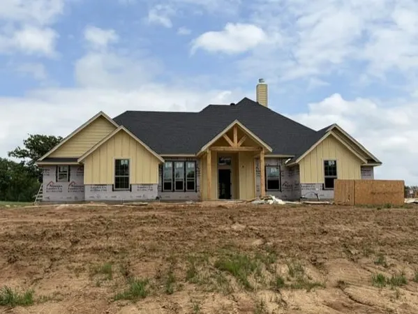 a view of a yard in front of a house with a yard