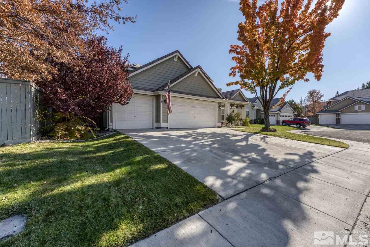 9720 Lemke Court Reno, NV 89521 - Photo 1 of 40 a view of a house with a yard and tree s