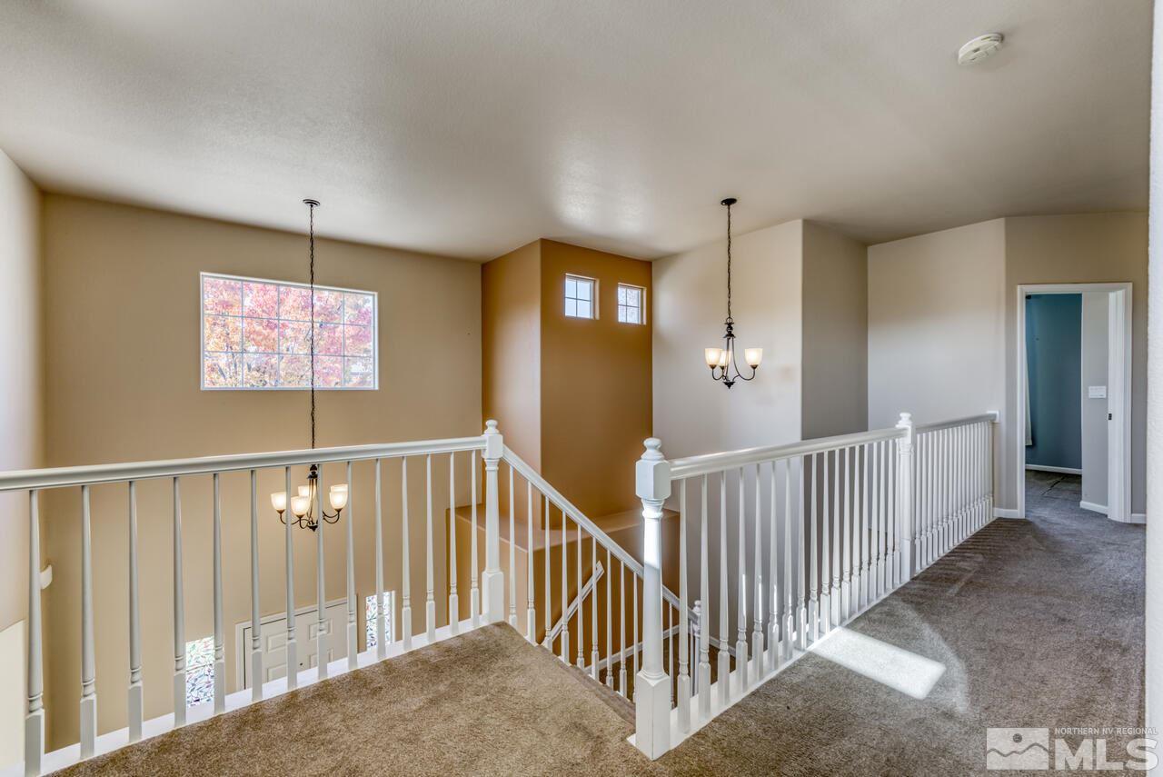 9720 Lemke Court Reno, NV 89521 - Photo 21 of 40 a view of a hallway with windows