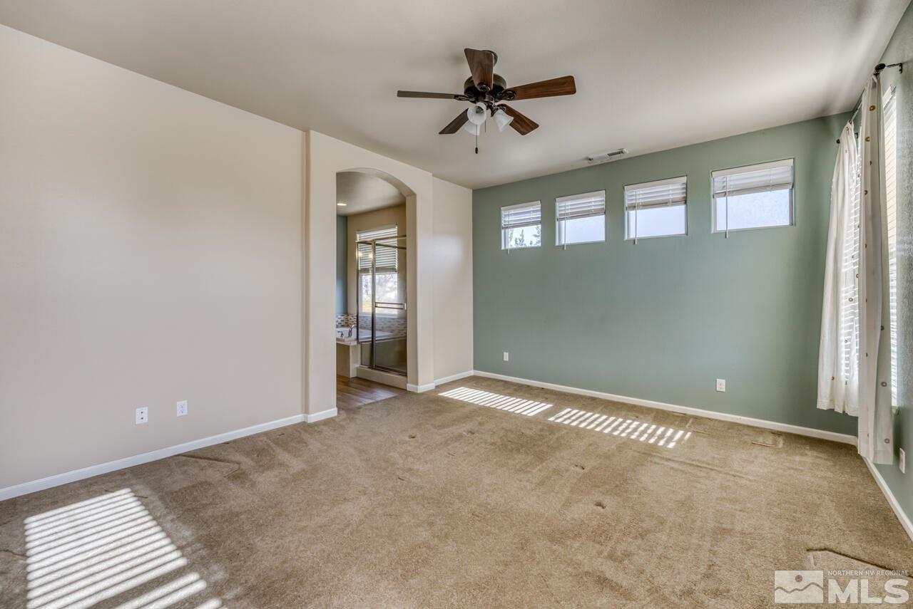 9720 Lemke Court Reno, NV 89521 - Photo 22 of 40 a view of a livingroom with a ceiling fan and window