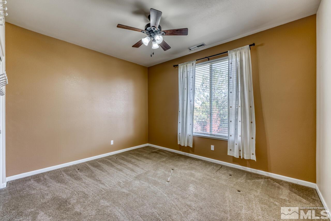 9720 Lemke Court Reno, NV 89521 - Photo 28 of 40 a view of room with window and ceiling fan