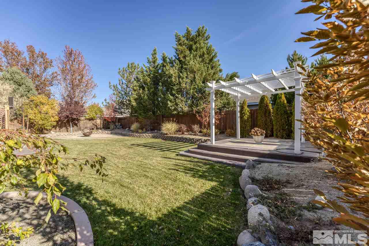 9720 Lemke Court Reno, NV 89521 - Photo 38 of 40 a view of a house with a yard