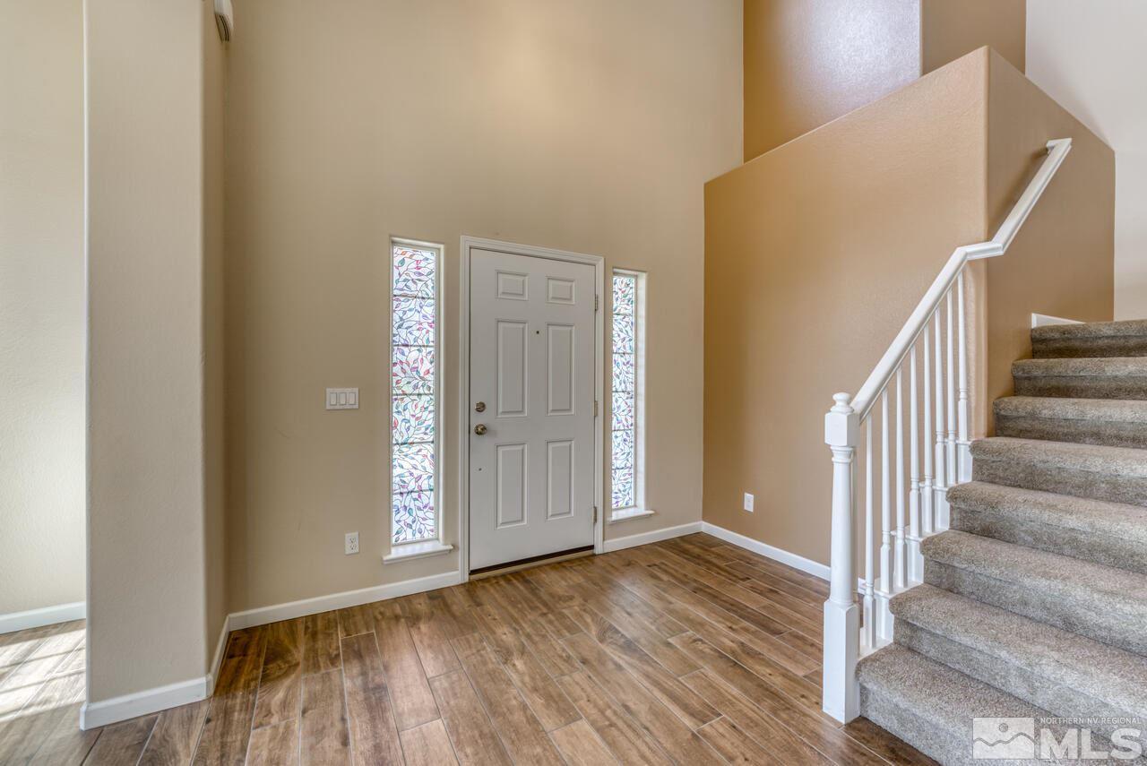 9720 Lemke Court Reno, NV 89521 - Photo 4 of 40 a view of an entryway with wooden floor