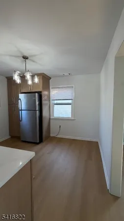 a kitchen with a sink stove and refrigerator