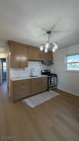 a spacious bathroom with a sink and a large mirror