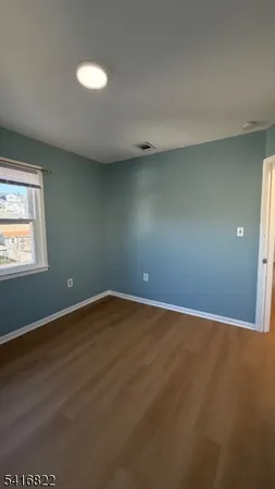 a view of an empty room with windows