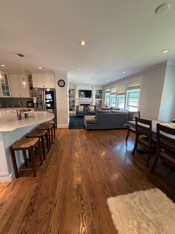 17 Cardinal Street, Unit 17 Winchester, MA 01890 - Photo 7 of 42 a living room with furniture and a wooden floor
