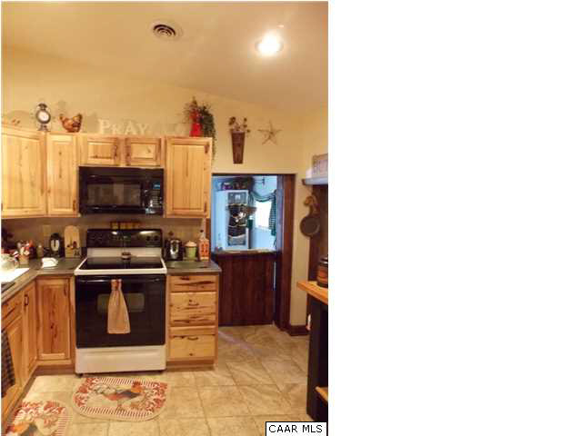 1222 Summerdean Road Middlebrook, VA 24459 - Photo 14 of 42 a kitchen with cabinets and stainless steel appliances