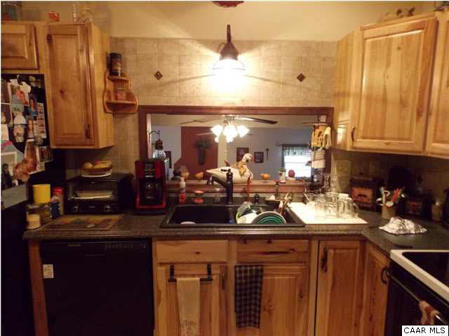 1222 Summerdean Road Middlebrook, VA 24459 - Photo 16 of 42 a kitchen with a sink and cabinets