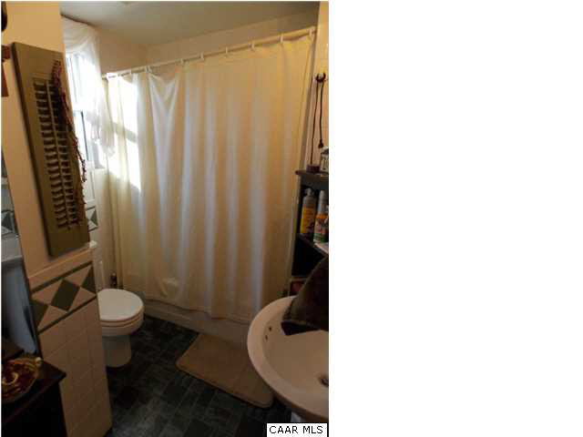 1222 Summerdean Road Middlebrook, VA 24459 - Photo 21 of 42 a bathroom with a sink toilet and shower