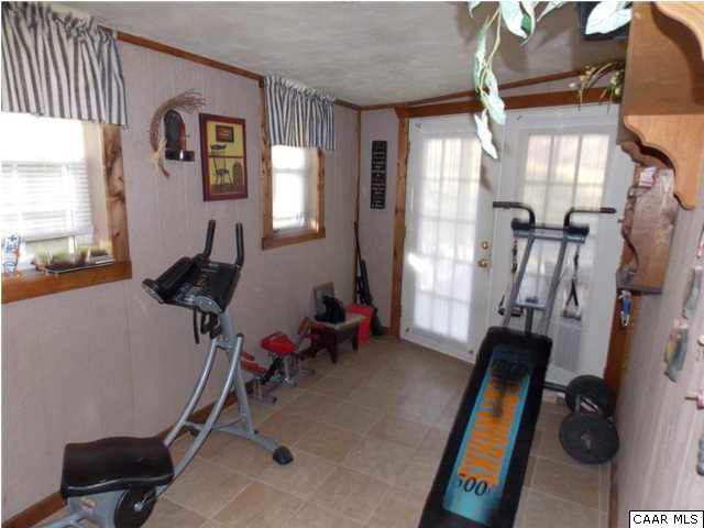 1222 Summerdean Road Middlebrook, VA 24459 - Photo 23 of 42 a room with gym equipment and a large window