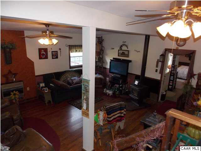 1222 Summerdean Road Middlebrook, VA 24459 - Photo 27 of 42 a living room with furniture and a mirror