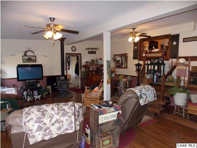 1222 Summerdean Road Middlebrook, VA 24459 - Photo 28 of 42 a living room with furniture a chandelier and a window