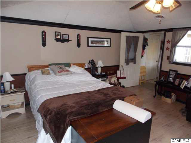 1222 Summerdean Road Middlebrook, VA 24459 - Photo 32 of 42 a bedroom with a bed and dresser