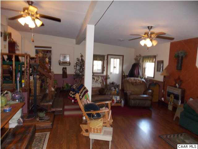 1222 Summerdean Road Middlebrook, VA 24459 - Photo 35 of 42 a view of a livingroom with furniture a chandelier fan and wooden floor