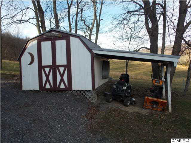 1222 Summerdean Road Middlebrook, VA 24459 - Photo 4 of 42 a backyard of a house with barbeque oven table and chairs