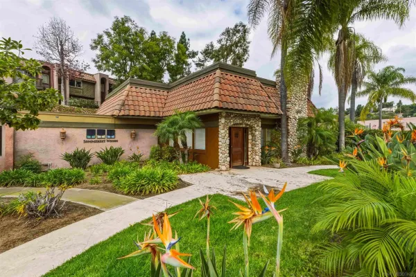 a front view of a house with a yard table and chairs
