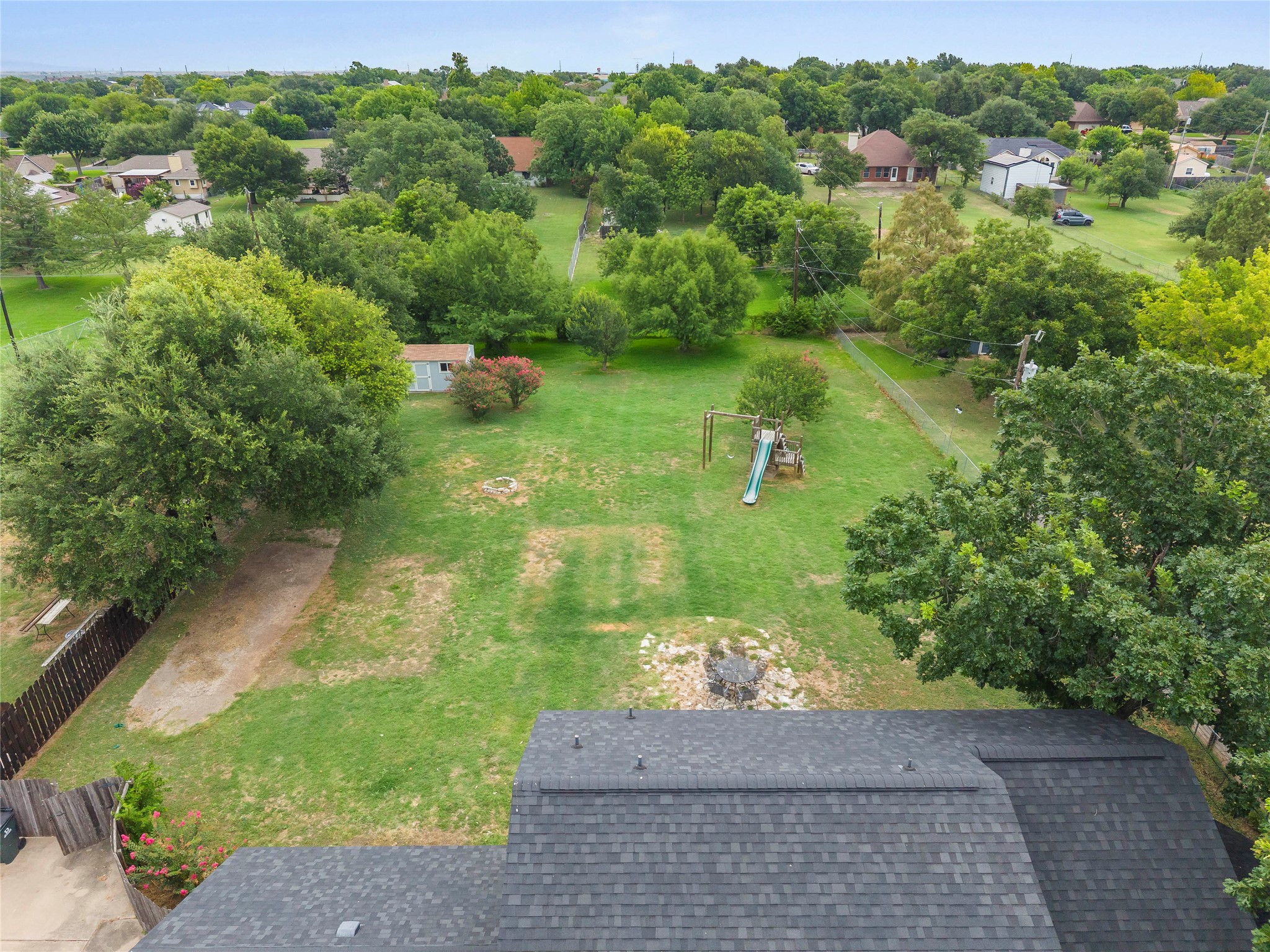 1329 Quail Ravine Round Rock, TX 78664 - Photo 6 of 39 Mature trees frame a sprawling grassy lawn offering abundant open space for outdoor recreation.