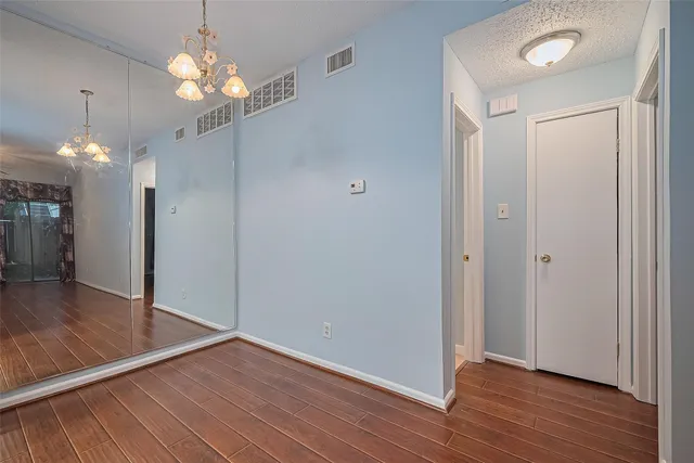 a view of a livingroom with wooden floor