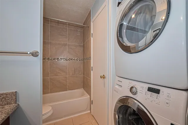 a view of bathroom with washer and dryer