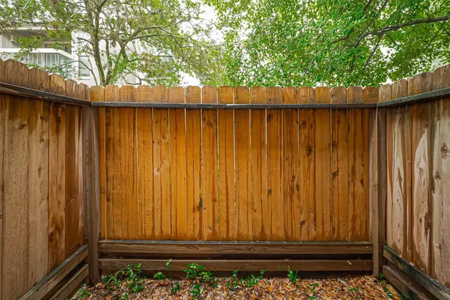 a view of door with wooden fence